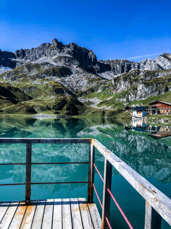 the boat is on the clear blue water