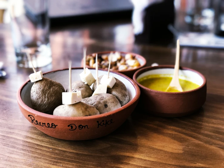 a couple of small wooden bowls sitting on a table