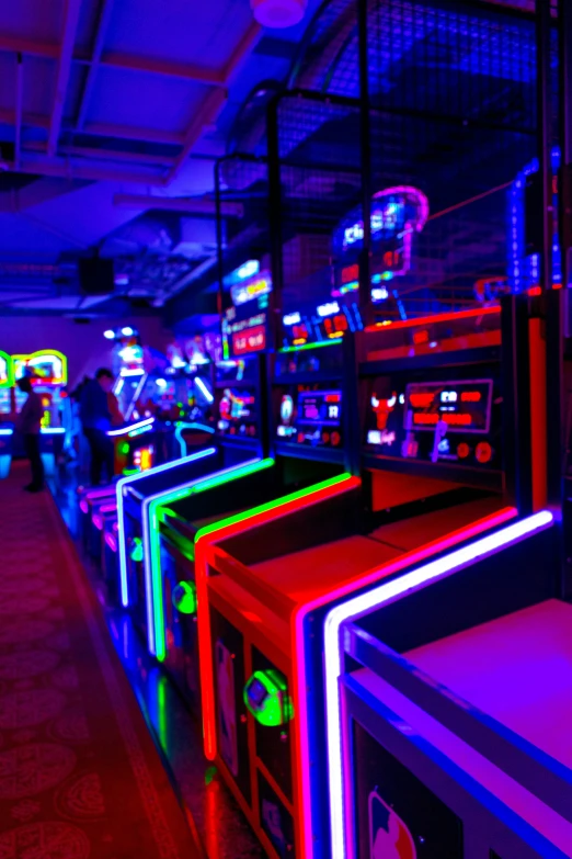 a room filled with neon lit electronic items