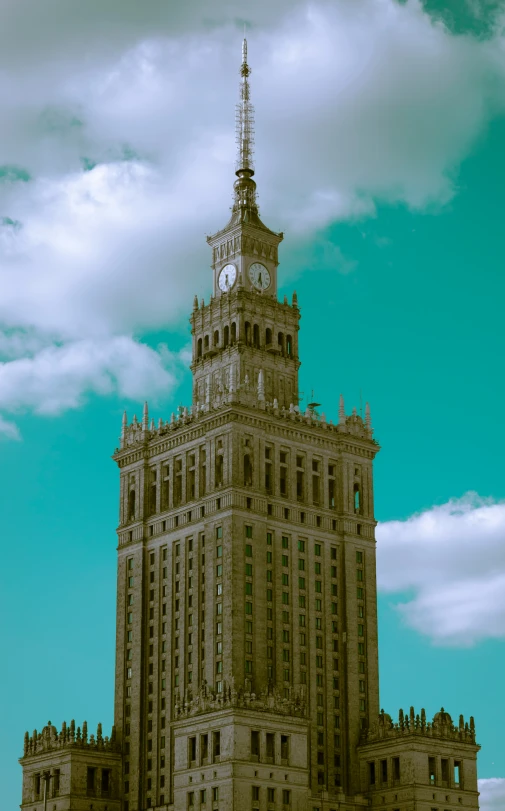 an old building with a clock tower on it's side