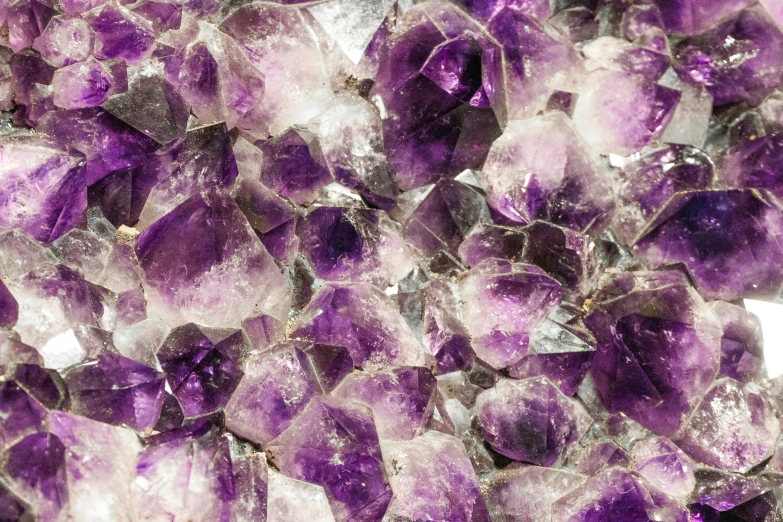 purple ayst crystals clustered together in a mixture