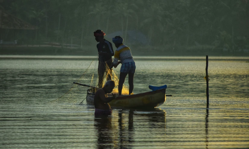 two people in a small canoe in the water