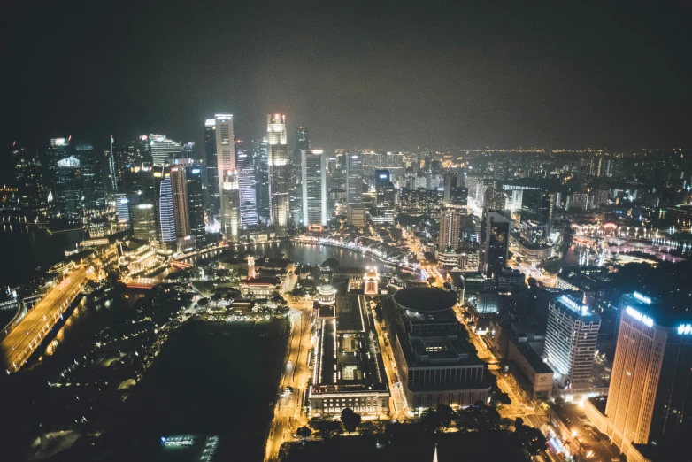 an aerial view of the lights of city buildings and skyscrs