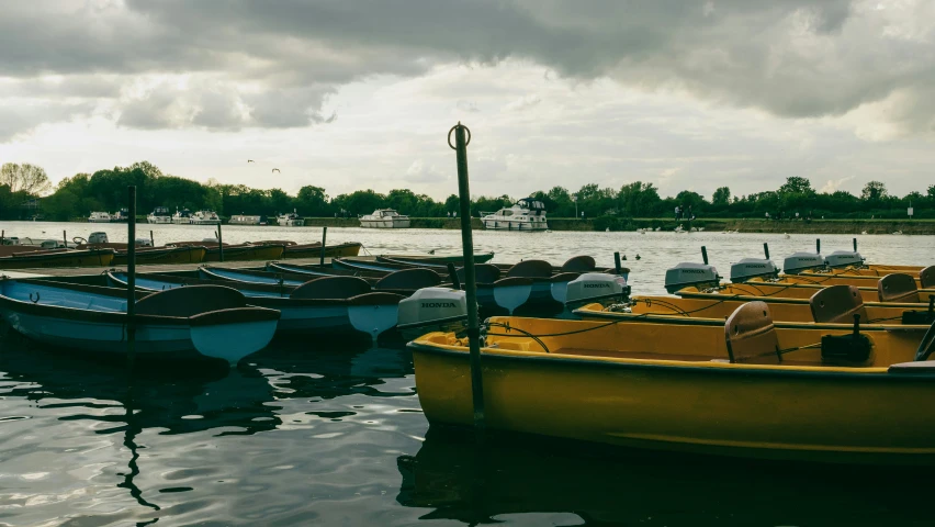 the boats are tied together in a body of water