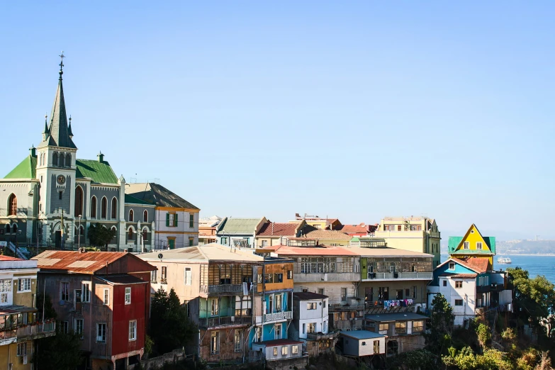 a row of houses sit side by side in a coastal area