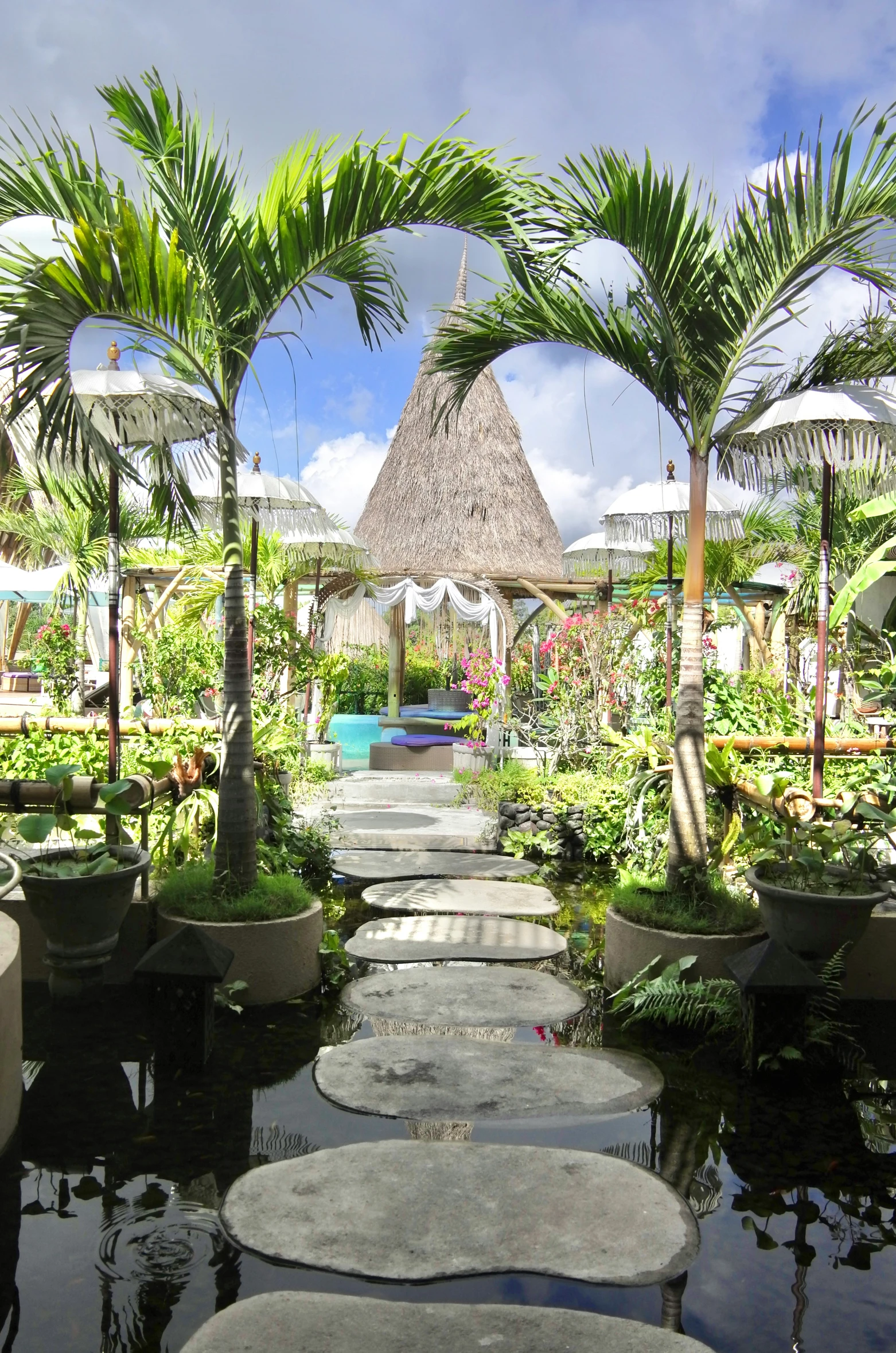 a pathway that leads up to a building with a gazebo