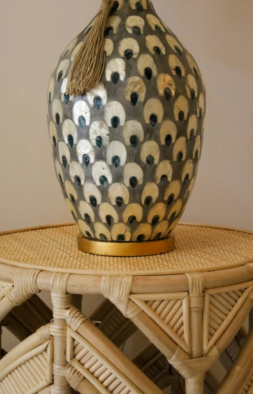 a unique vase is sitting on top of the table