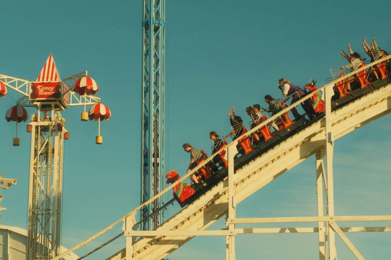 several people on a carnival ride in a roller coaster