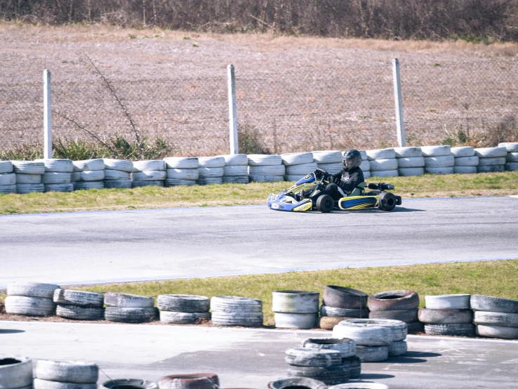 the motorcycle is racing around a track with several tires