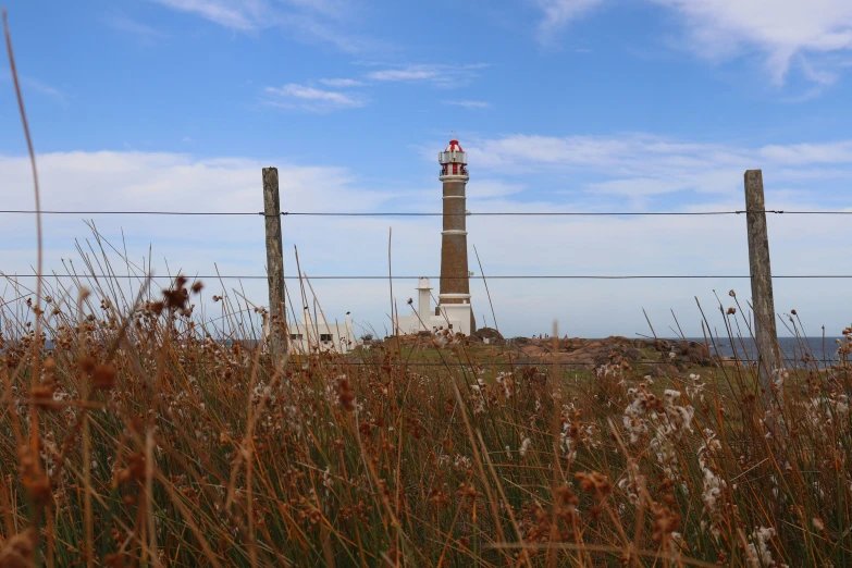 tall tower with two lighthouses in the distance