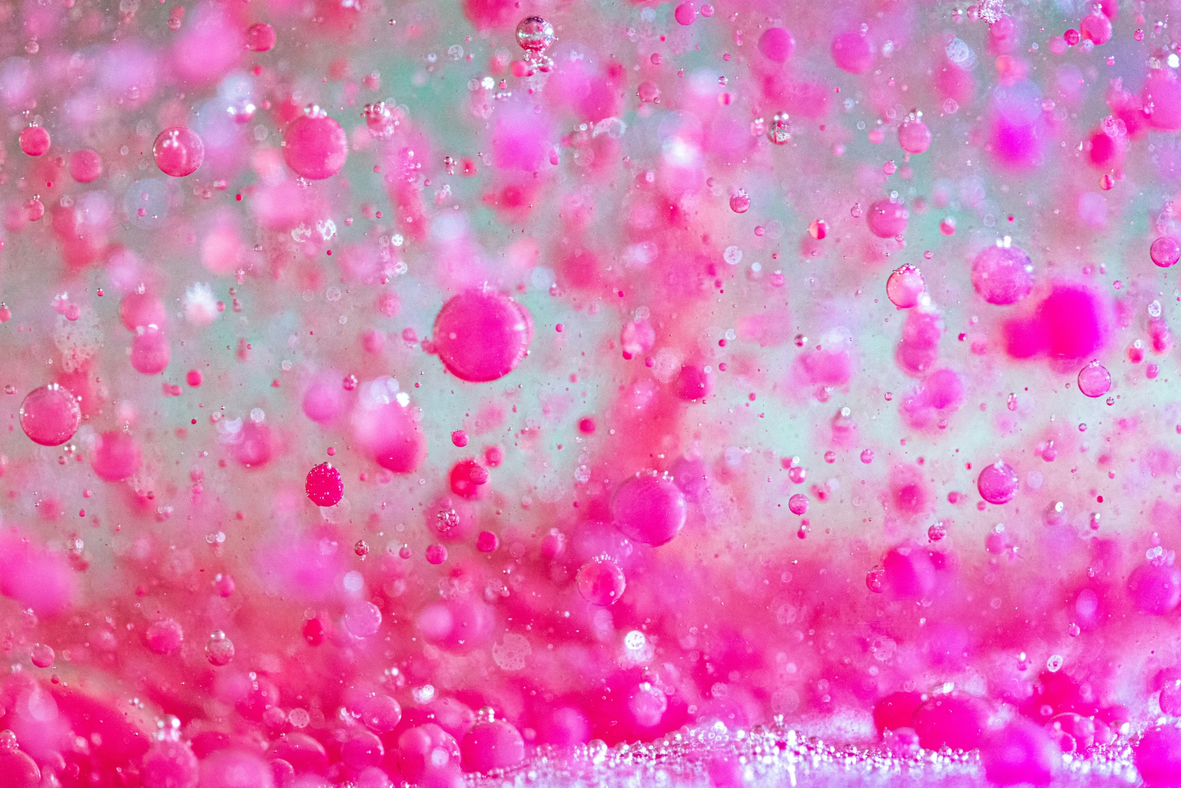 water drops are shown in this pink liquid