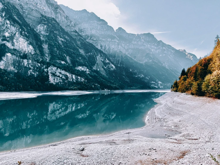 a view of a body of water surrounded by mountains