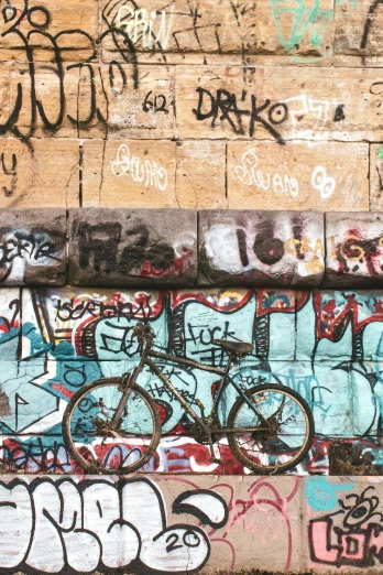 graffiti is shown on the wall and a bicycle