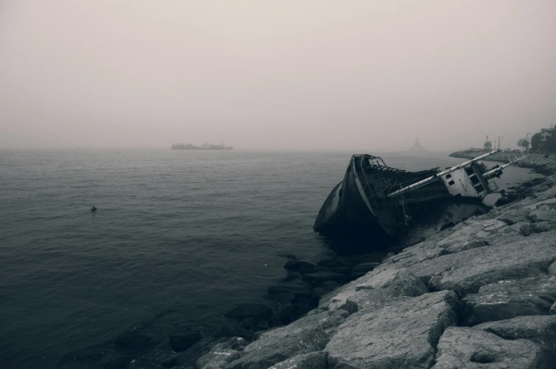 a boat washed up on the shore in a storm