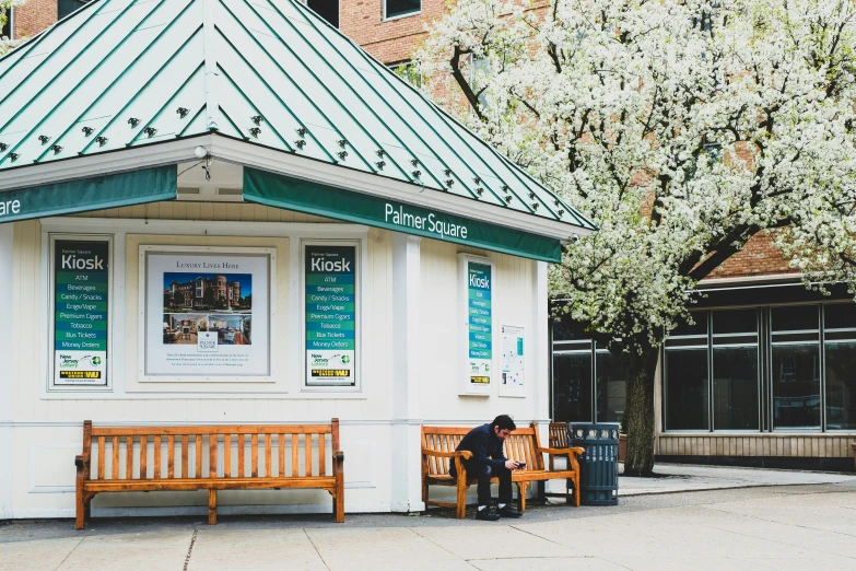 a couple of benches near a small building