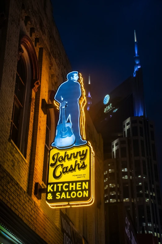 a sign advertising a restaurant on a city street