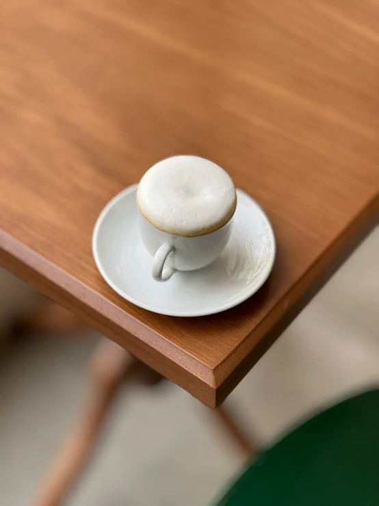 a cup with a saucer in the shape of a ring