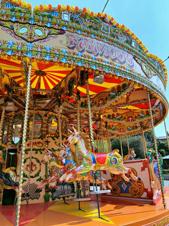 a merry go round at the fair with colorful lighting