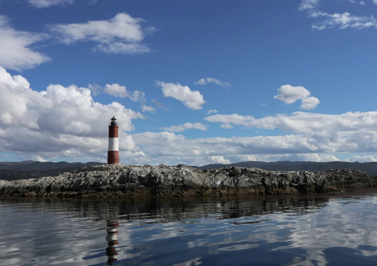 a lighthouse in the middle of some water