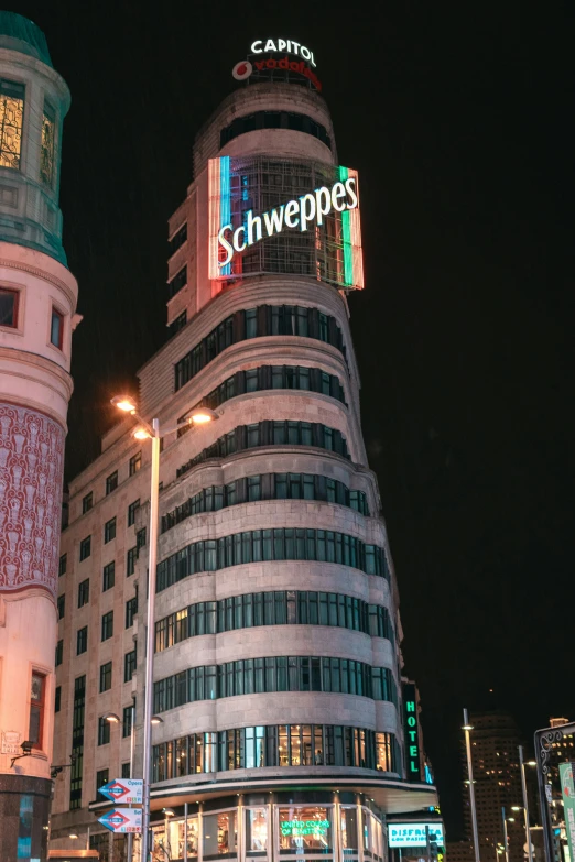 a very tall building with a sign that says schnepps