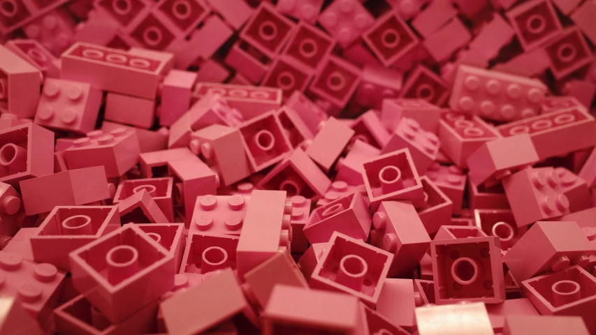 a pile of little toy blocks in pink