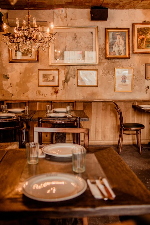 the large dining room with art above it