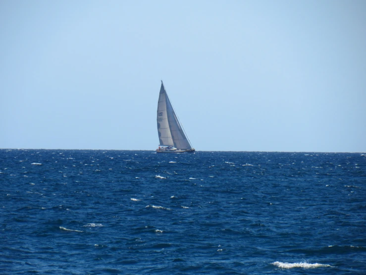 a sailboat floating on top of the water