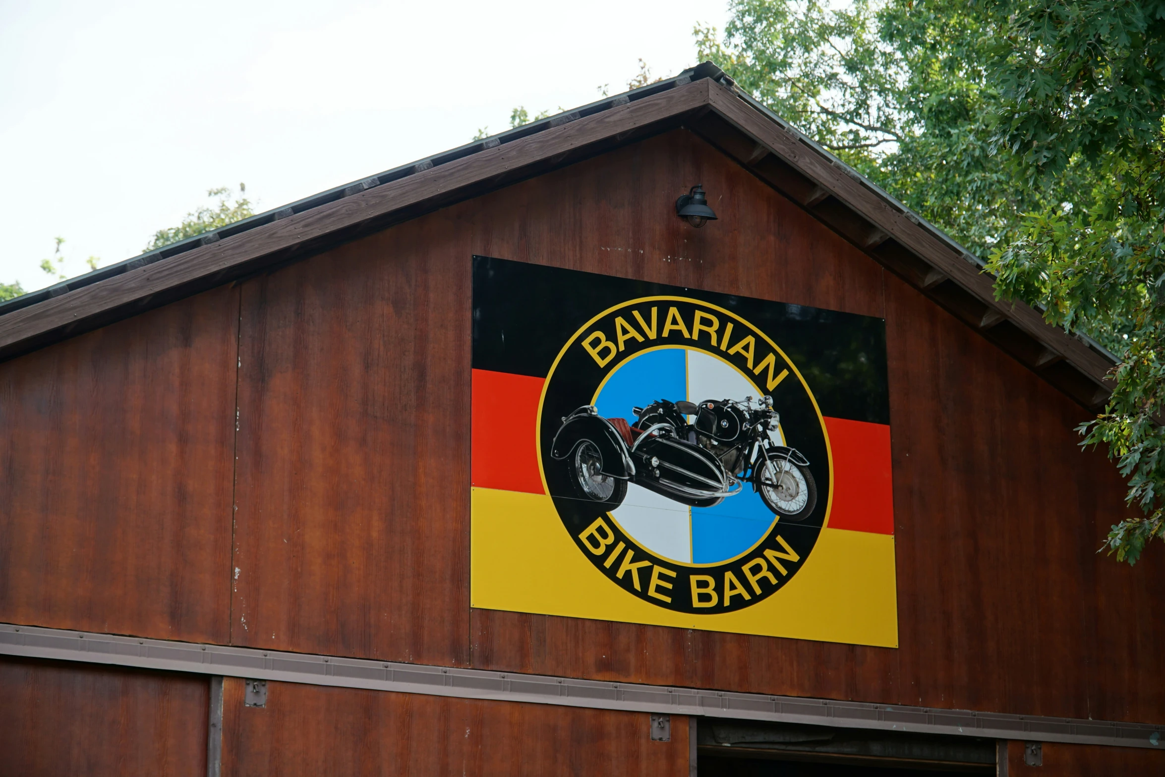 a building with a motorcycle shop and sign on it