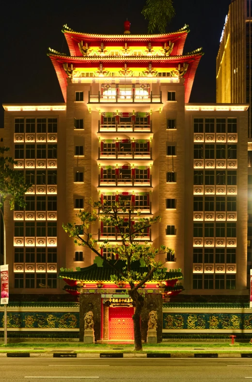 lighted chinese structure on a night city street