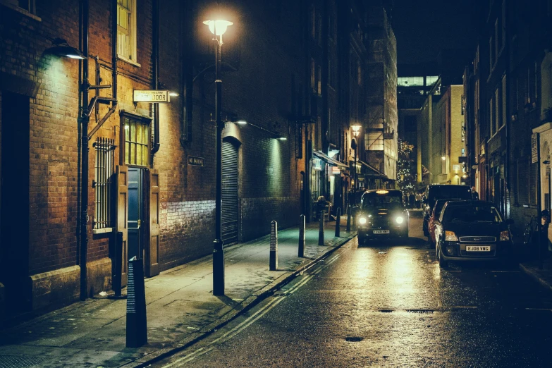 a car parked on the side of the road with its lights on