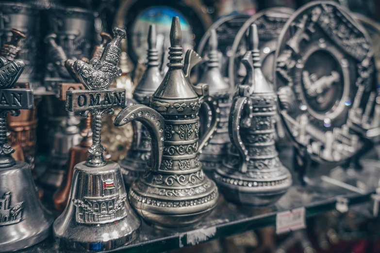 a collection of small metal objects sitting on display