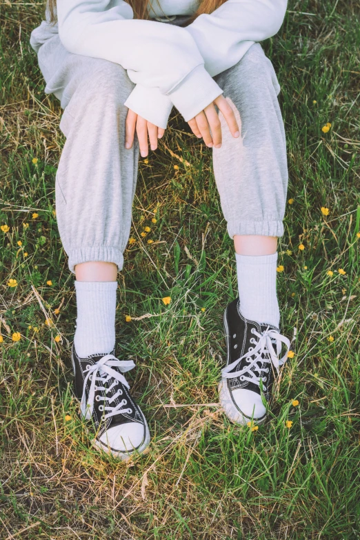 a  sitting on the ground covered with white clothing