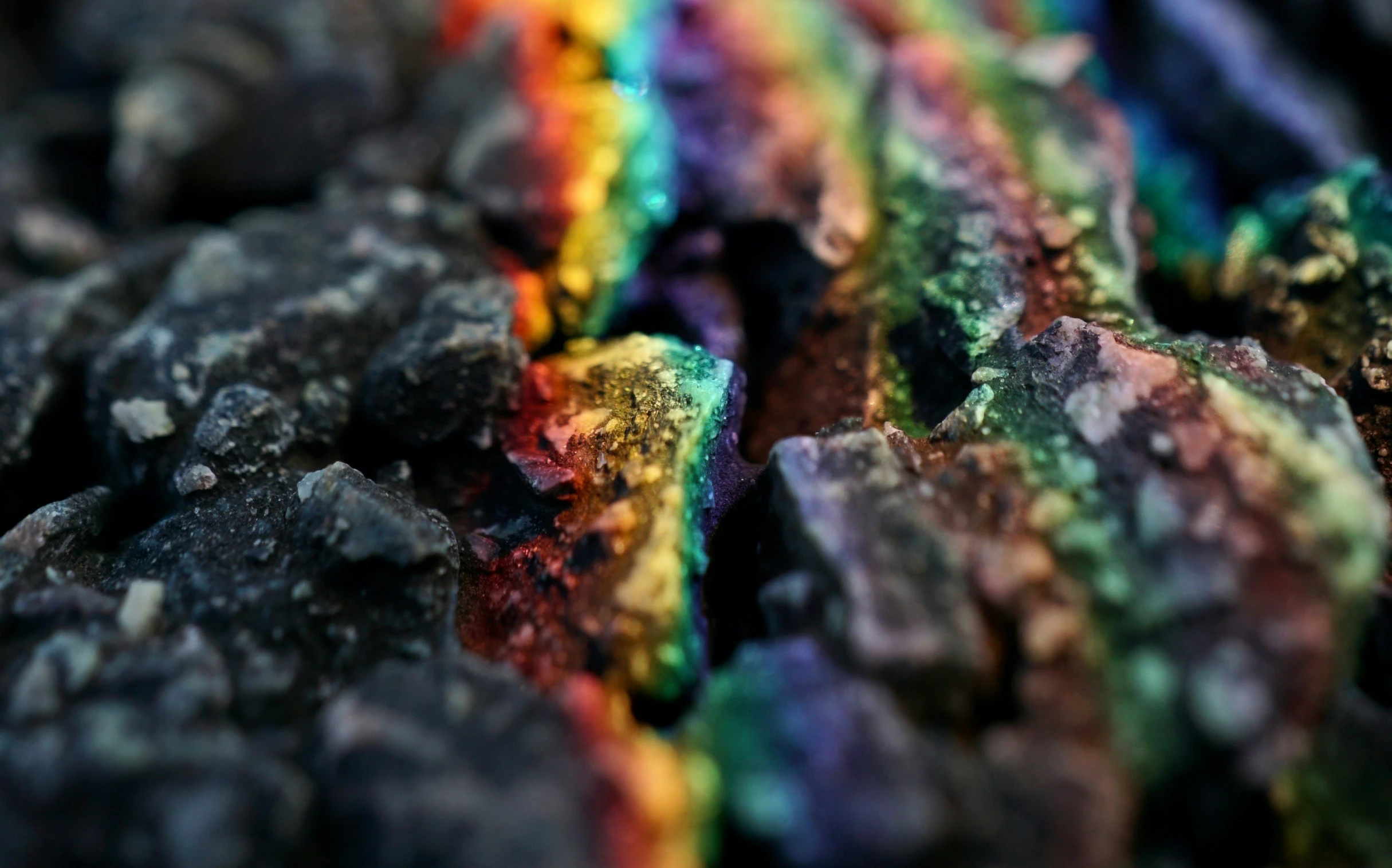 a close up of a rainbow colored substance