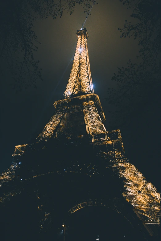 a night time view of the eiffel tower