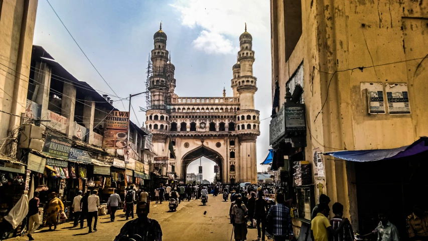 pedestrians are walking around in the old city