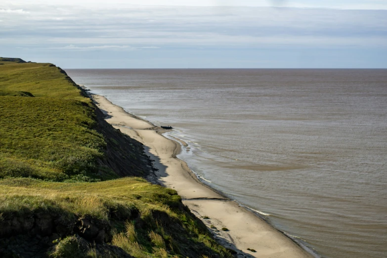 a long stretch of sand near the sea