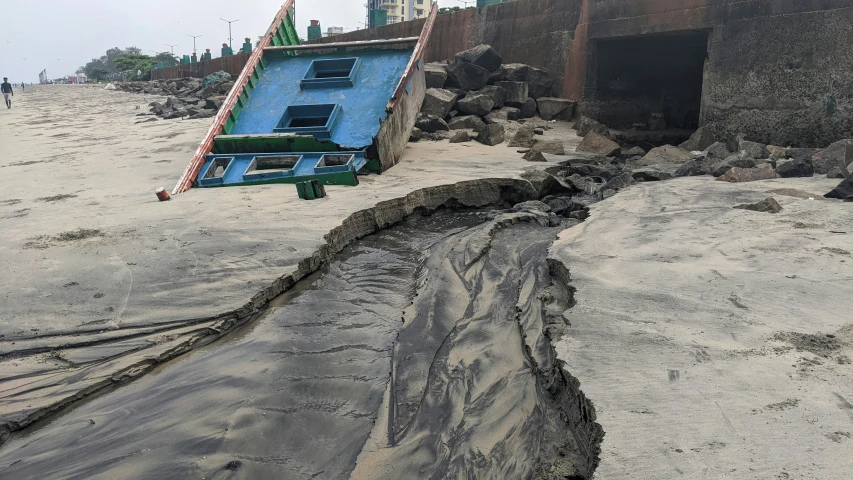 the ocean has been dug into by the tide and it is nearly there