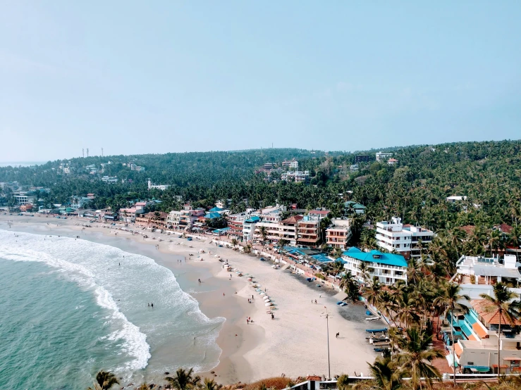 many buildings near a beach with a blue roof