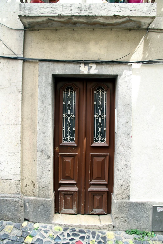 two doors with glass on the sides of them