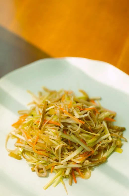 some green sprouts that are on a plate