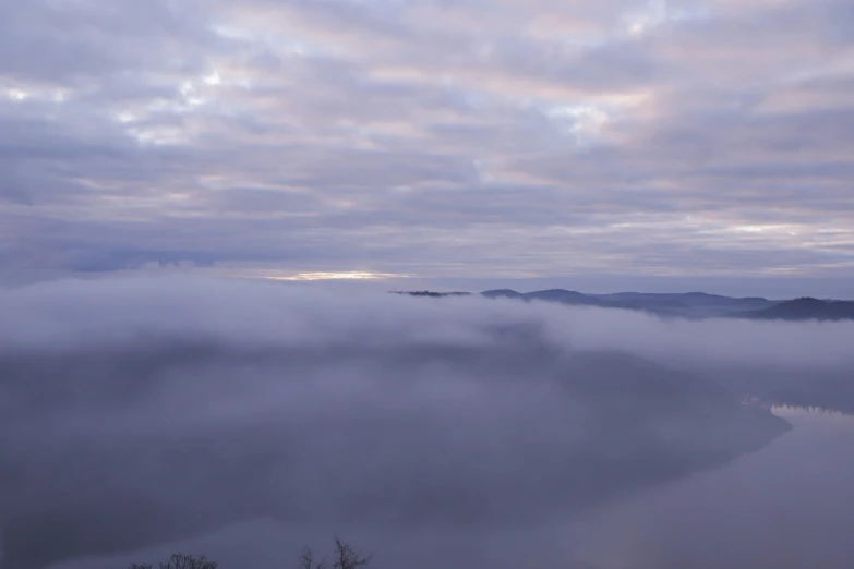 the lake has fog covering it and it's water