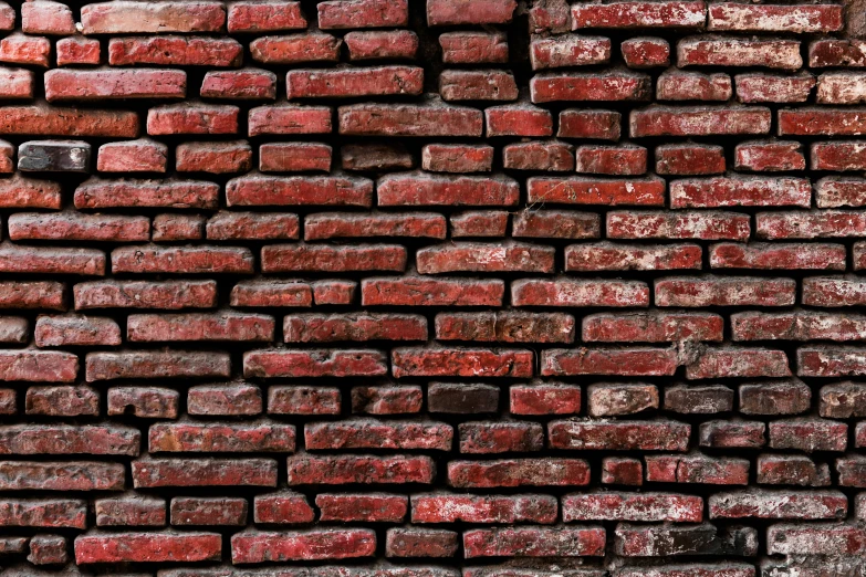 an old brick wall is displayed as it is red