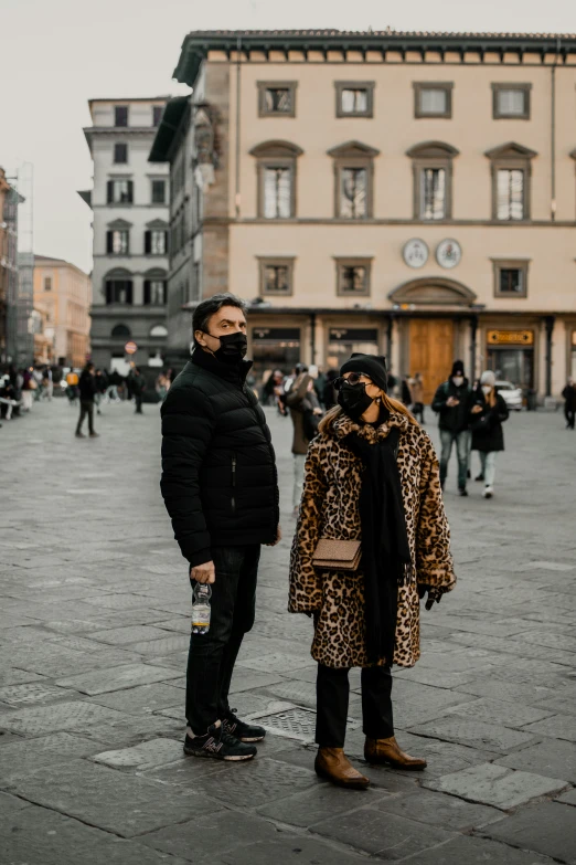 a man and woman standing next to each other