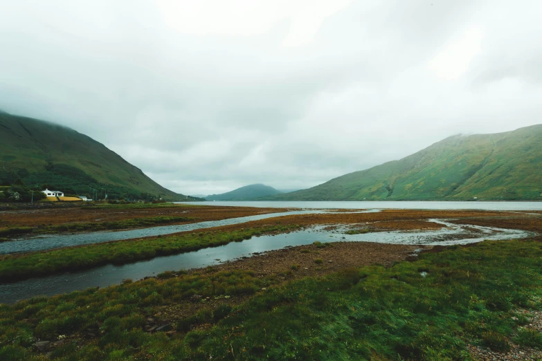 a stream of water that is running through the mountains