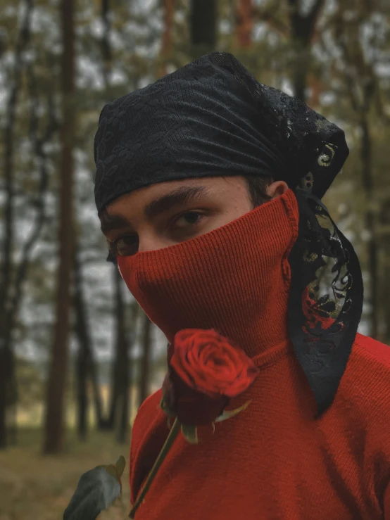 a woman has a rose tied to her neck and it has black bandana