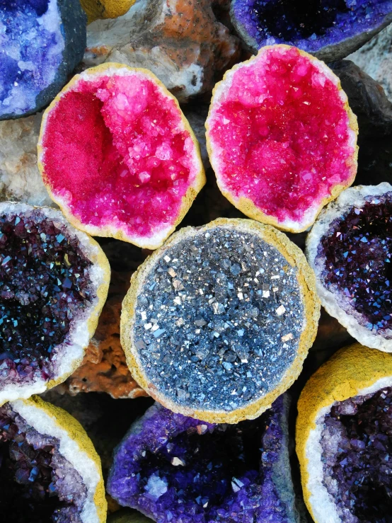 a table with colorful food that is all different colors