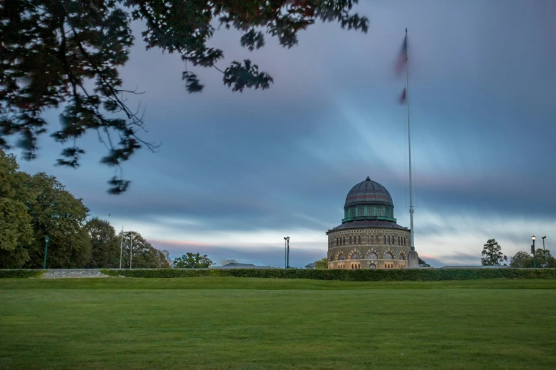 there is a tall dome building with an american flag on top