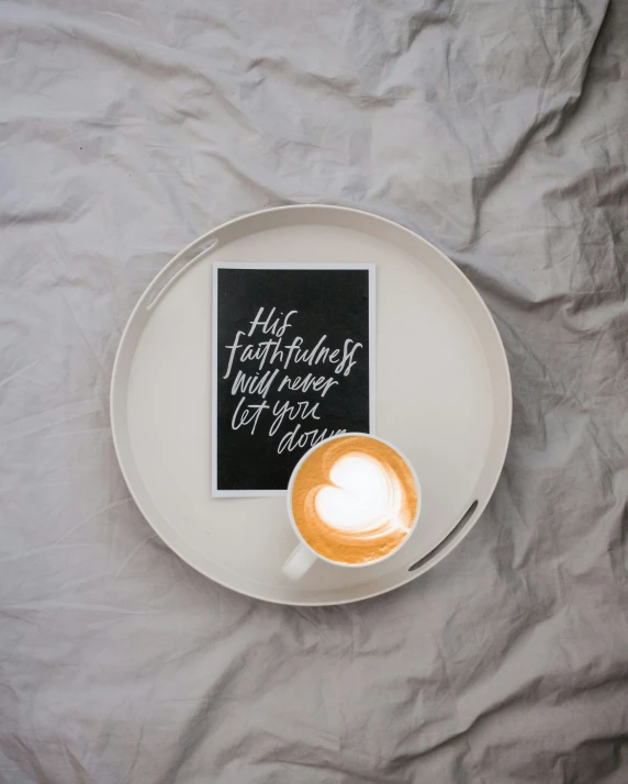 a plate of coffee is sitting on a table