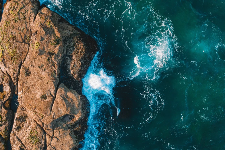 an aerial s of some water and rocks