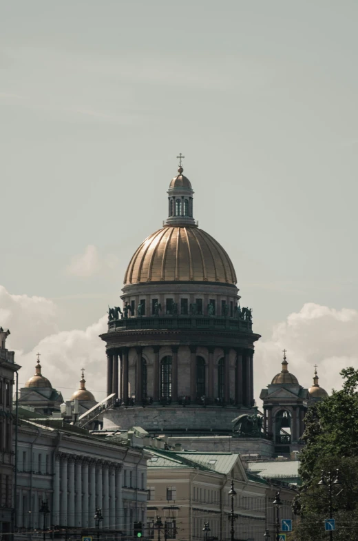 a building with golden domes rises into the distance